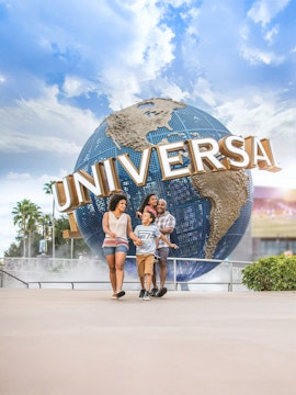 Family walking in front of Universal Globe at Universal Studios Resort, Orlando.