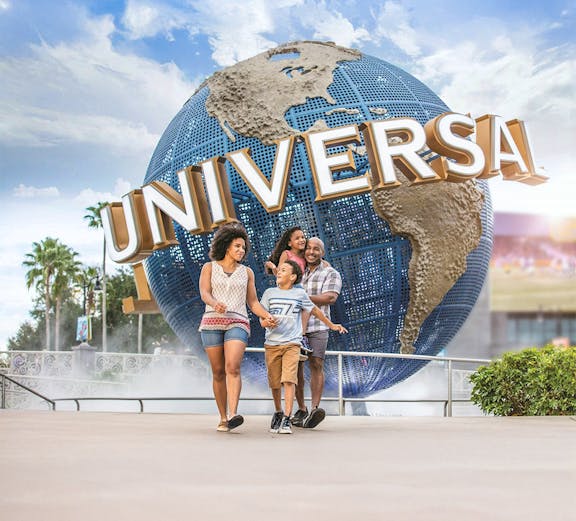 Family walking in front of Universal Globe at Universal Studios Resort, Orlando.