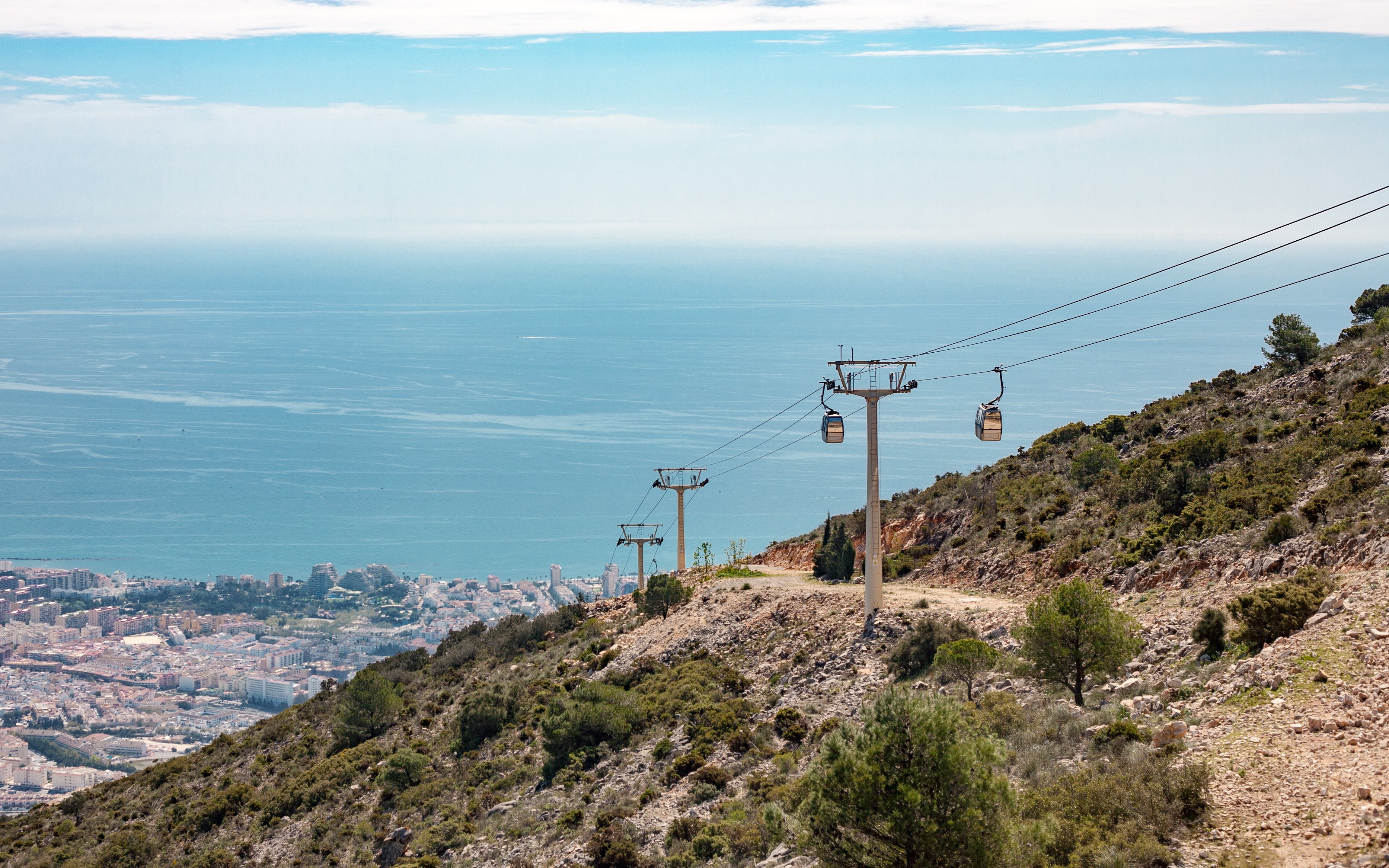 Benalmadena cable car ascending hillside with sea view, Malaga, Spain.