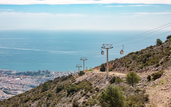 Benalmadena cable car ascending hillside with sea view, Malaga, Spain.