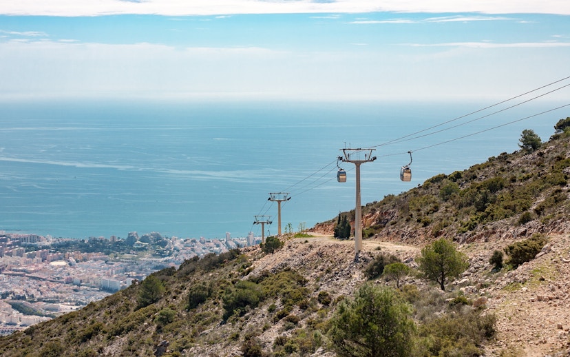 Benalmadena cable car ascending hillside with sea view, Malaga, Spain.