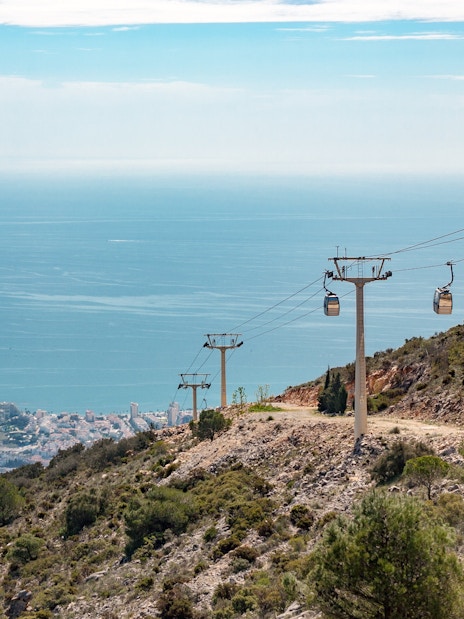 Benalmadena cable car ascending hillside with sea view, Malaga, Spain.