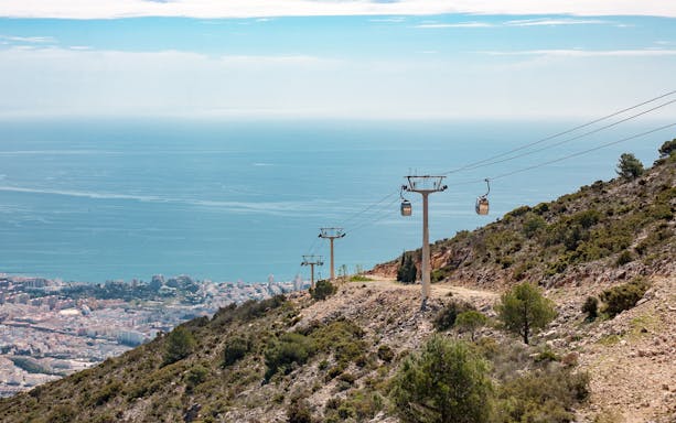Benalmadena cable car ascending hillside with sea view, Malaga, Spain.
