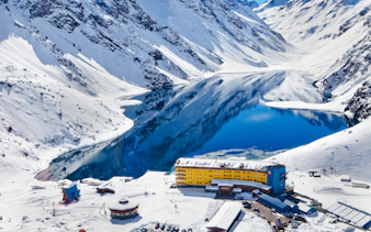 Portillo Hotel and snow-covered Andes by Laguna del Inca, Santiago.