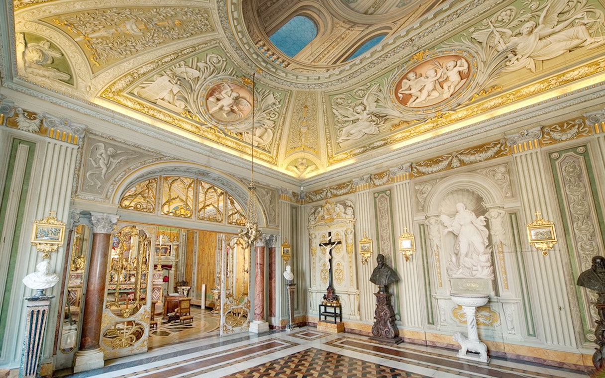 Ornate ceiling and sculptures in Doria Pamphilj Gallery, Rome.