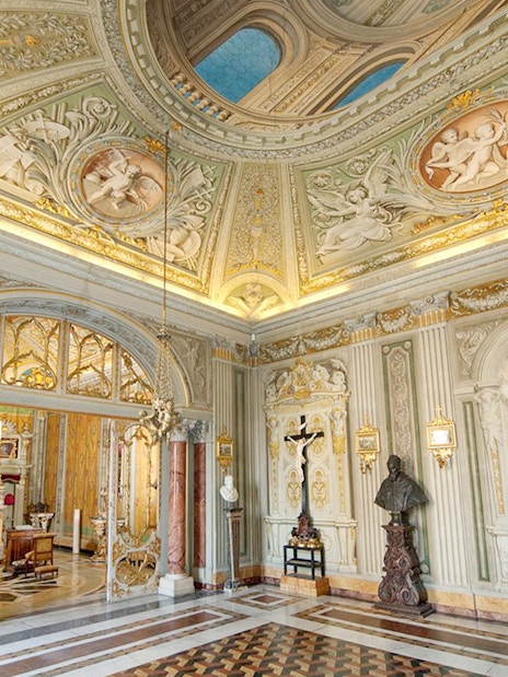 Ornate ceiling and sculptures in Doria Pamphilj Gallery, Rome.
