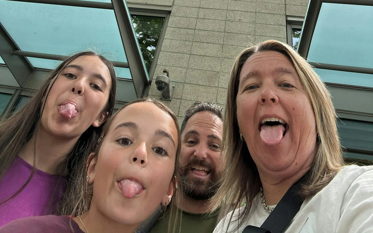 Family enjoying a playful moment during Seattle city exploration game.