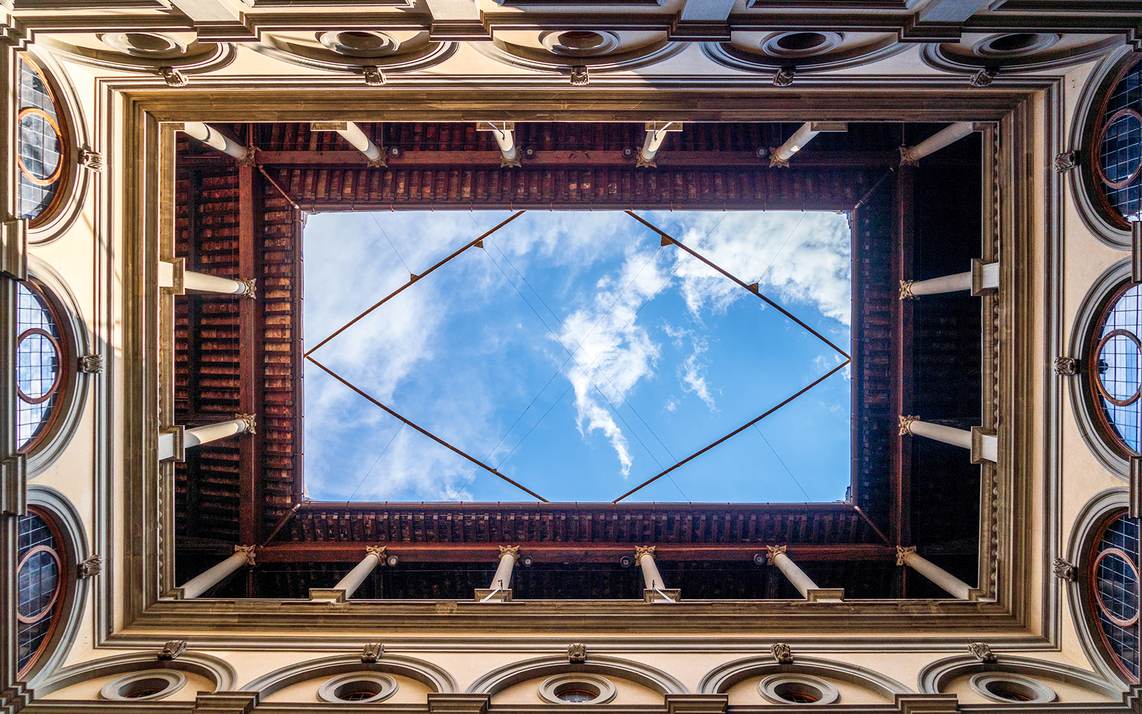 Looking up at the courtyard ceiling of the Uffizi Gallery in Florence, Italy.