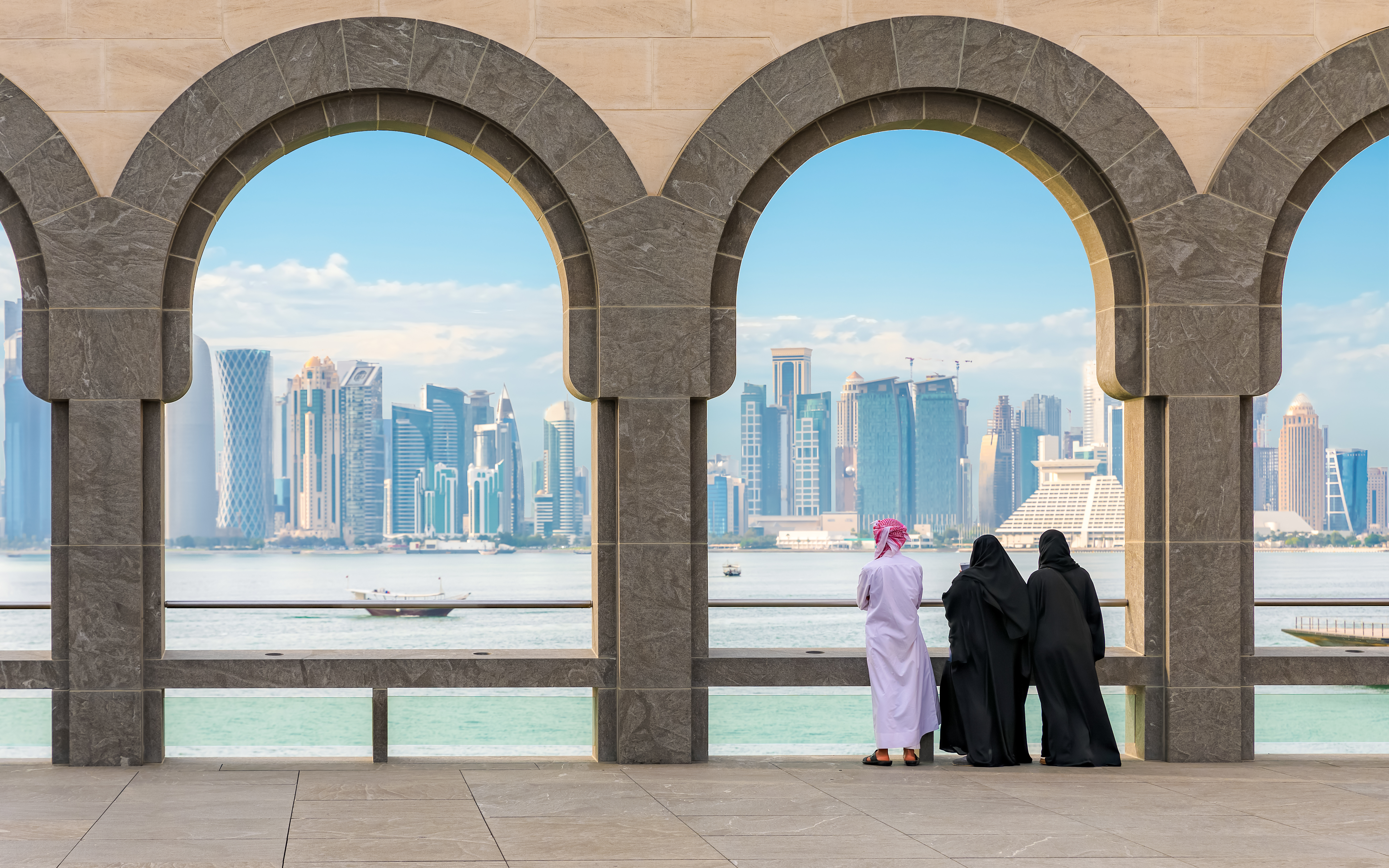 Tourists looking at the view of the skyline of Doha, Qatar