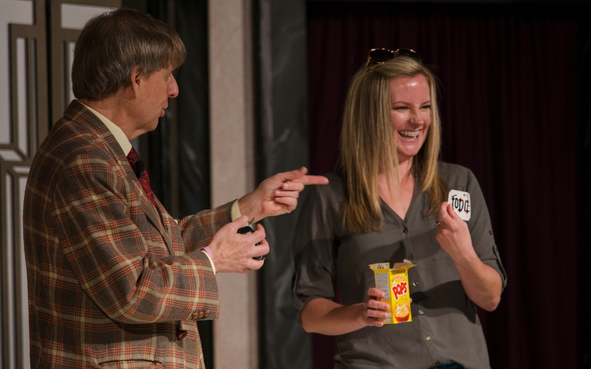 Magician interacting with audience member during The Mac King Comedy Magic Show in Vegas.