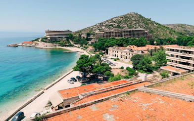 Abandoned hotels and coastline in Dubrovnik, highlighting Yugoslavia's breakup history tour.