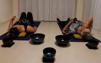 Participants lying on mats during a private Japanese sound bath meditation in Kyoto.