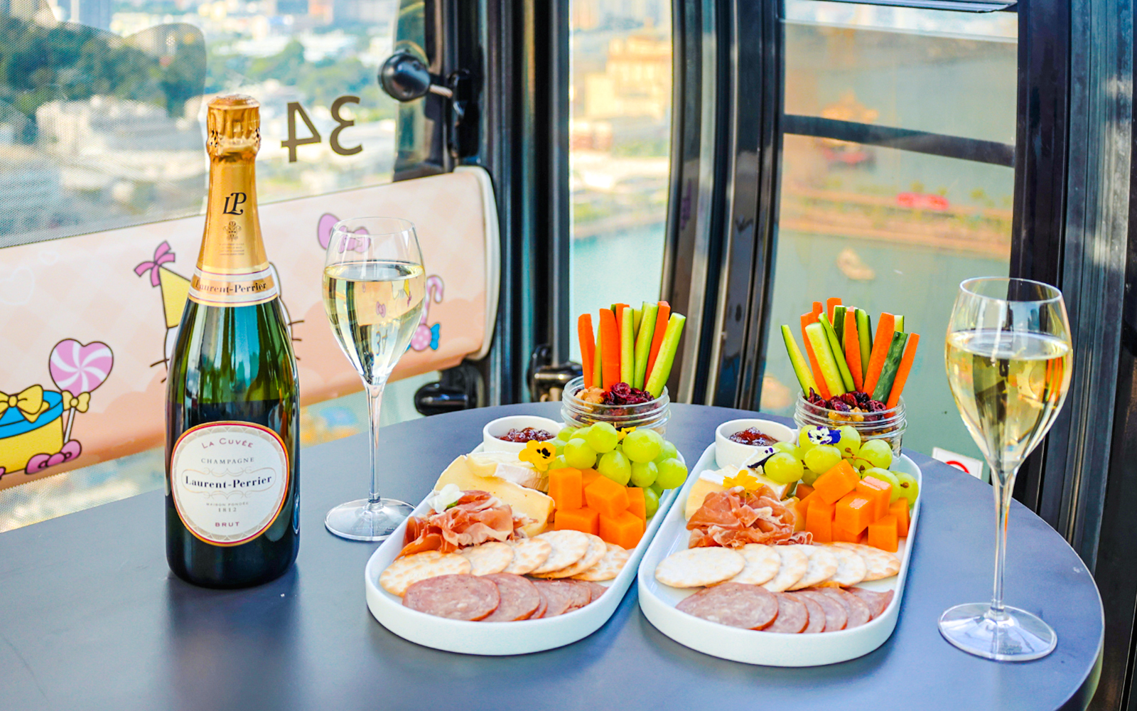 Singapore cable car dining with champagne, charcuterie, and city view.