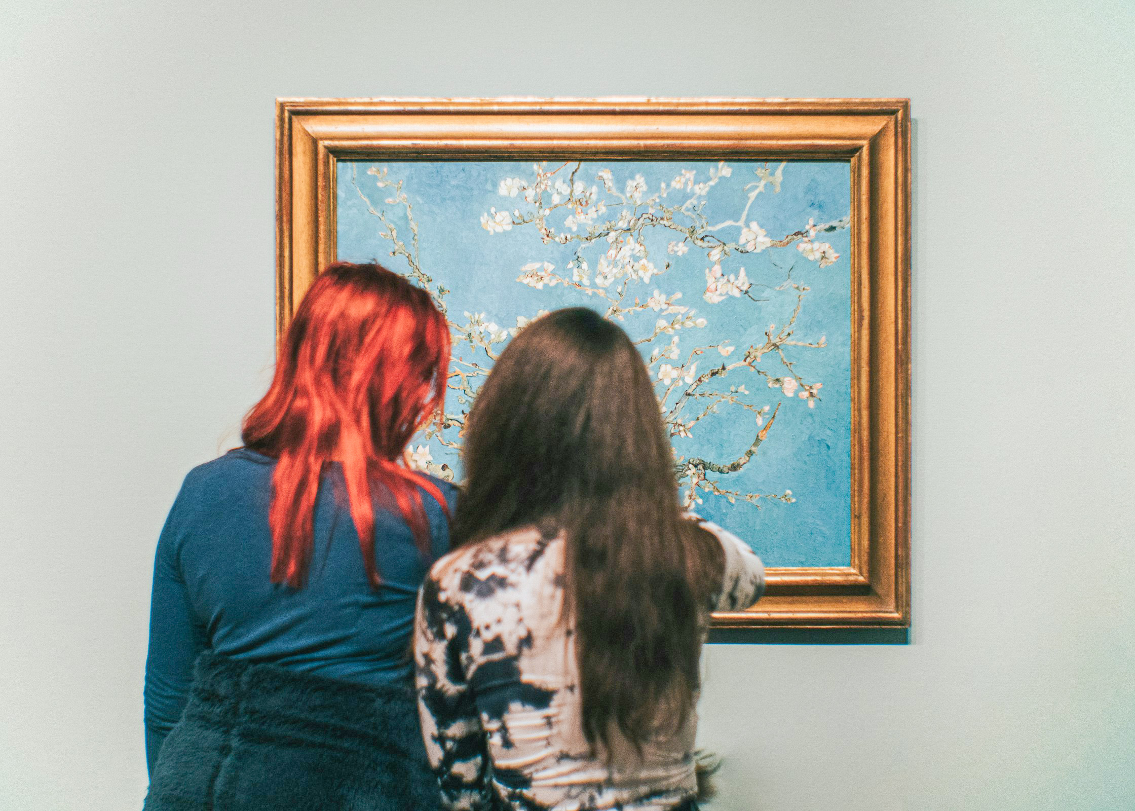 Visitors viewing Van Gogh's Almond Blossom painting at the Van Gogh Museum.