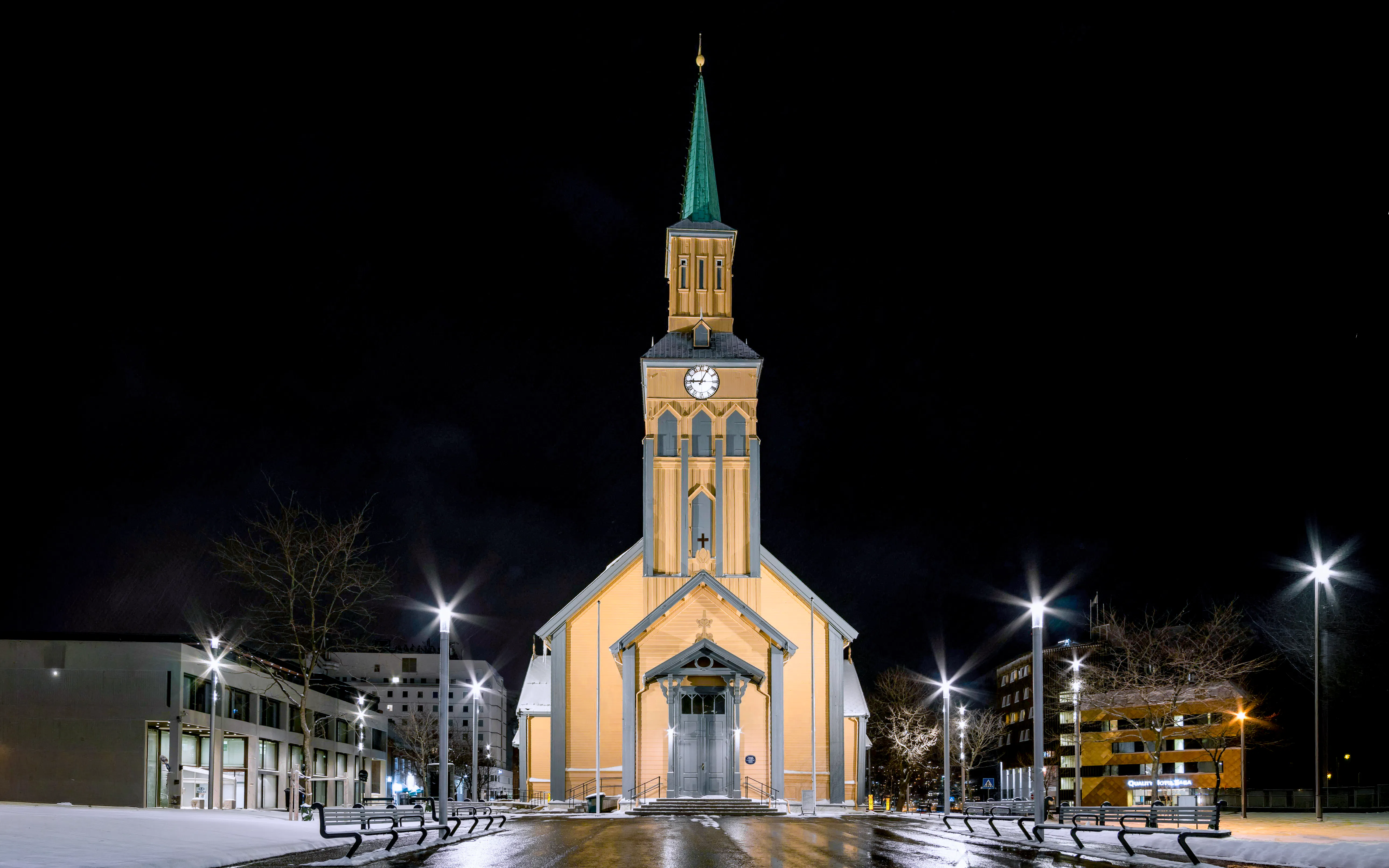Tromsø Cathedral illuminated at night, venue for Arctic Music Experience concert.
