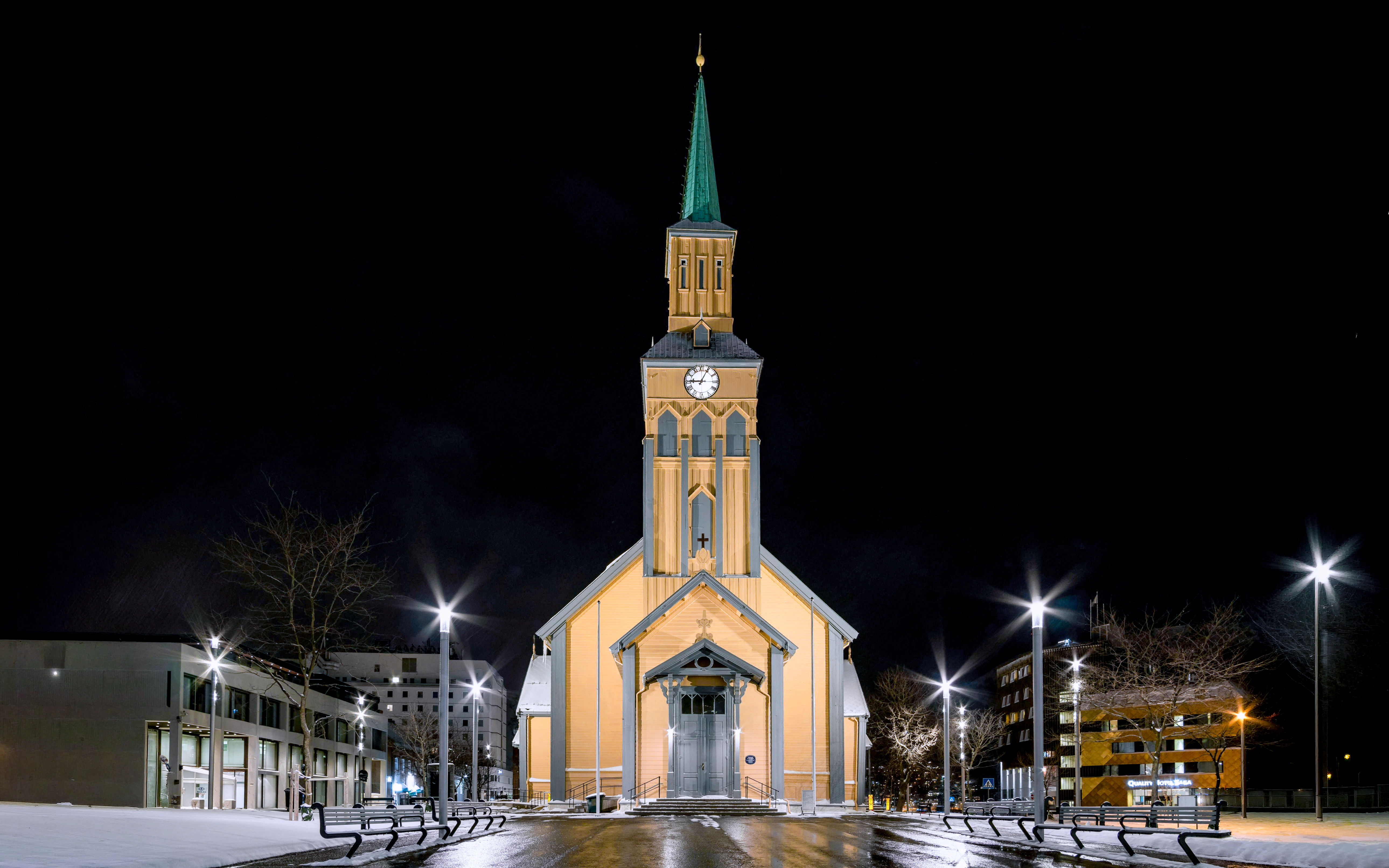 Tromsø Cathedral illuminated at night, venue for Arctic Music Experience concert.