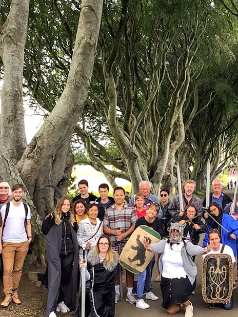 Tour group at Dark Hedges, a Game of Thrones filming location in Belfast.