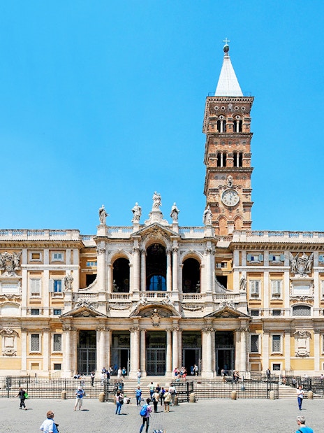 Basilica Santa Maria Maggiore in Rome with tourists in the foreground.