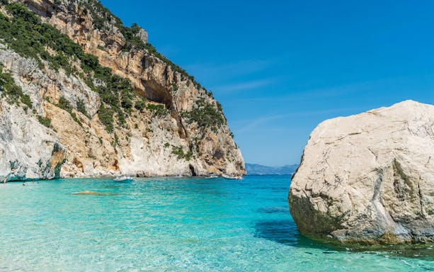 Blue water and rocks at a beach in the Gulf of Orosei