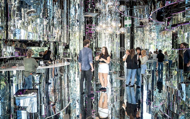 Guests enjoying drinks at the reflective Mirror Bar in Surfers Paradise.