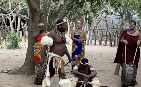 Zulu cultural performance in traditional attire, Durban tour.