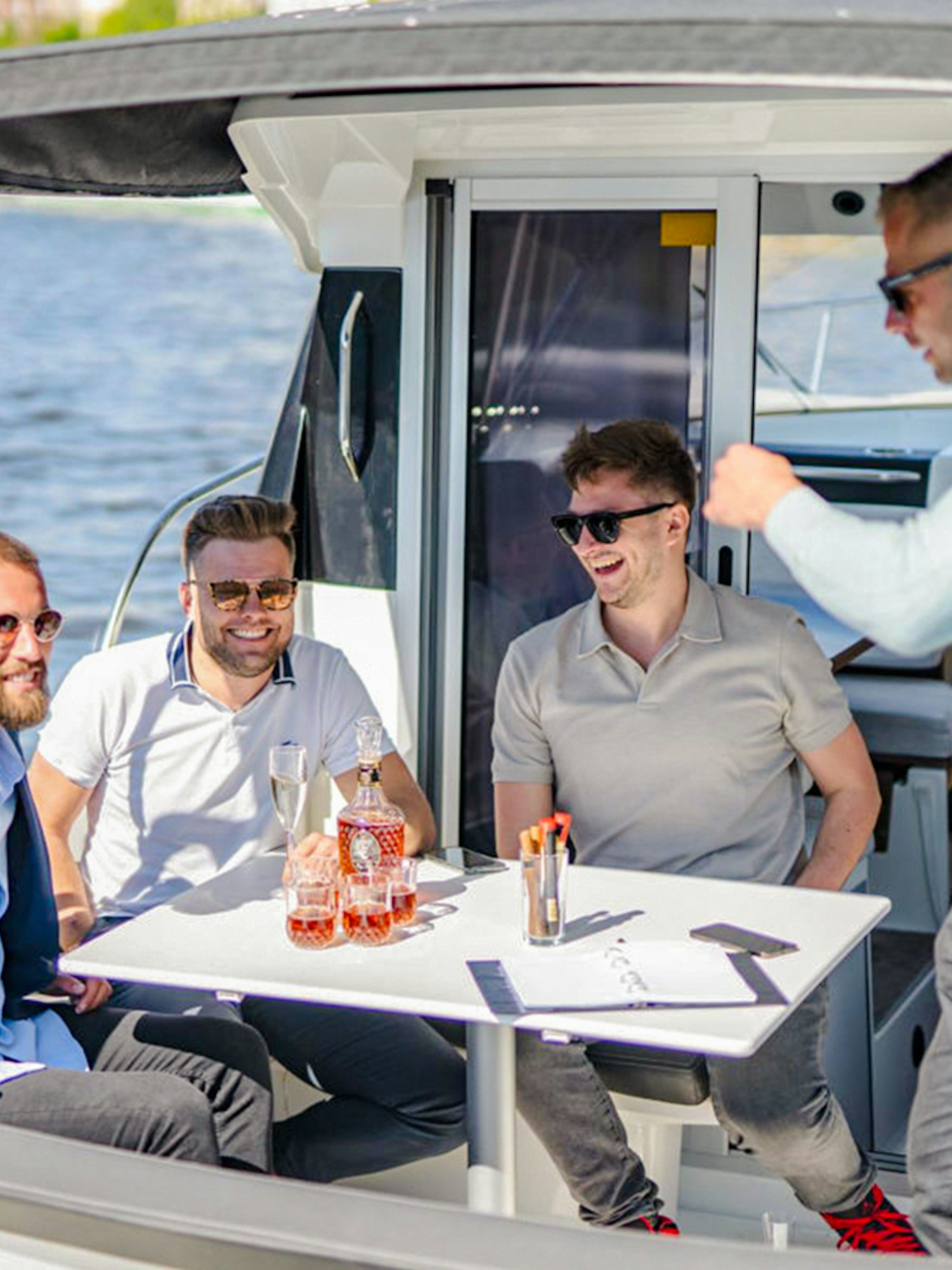 Group of friends enjoying Prosecco on a speed boat.