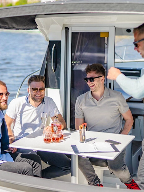 Group of friends enjoying Prosecco on a speed boat.