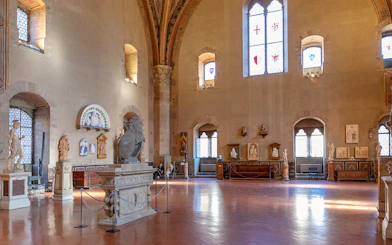 Interior of Museo del Bargello in Florence, showcasing sculptures and Renaissance art.