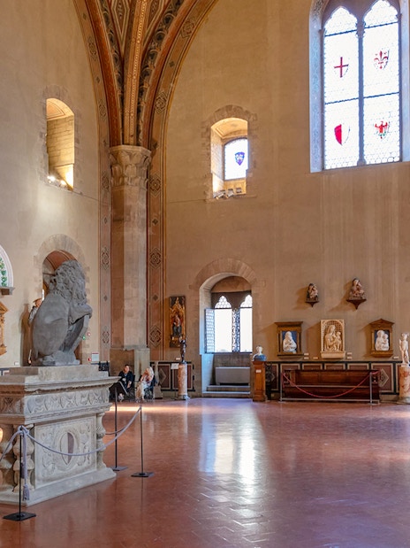 Interior of Museo del Bargello in Florence, showcasing sculptures and Renaissance art.