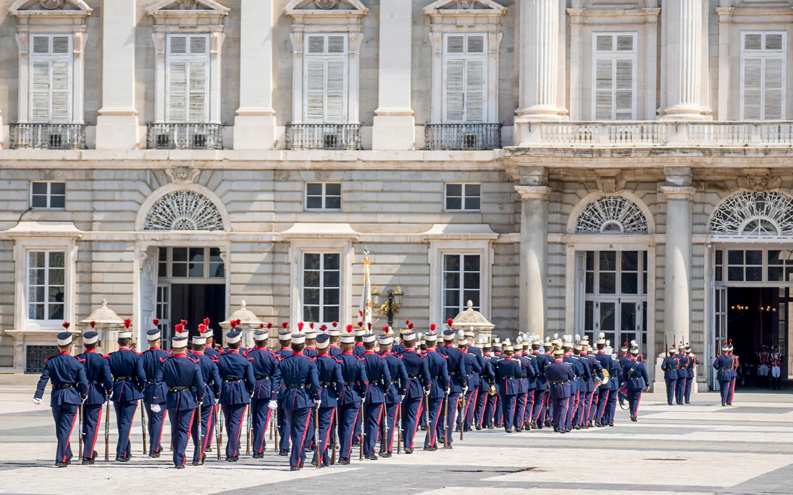 Guards marching at the Royal Palace in Madrid during the changing of the guard ceremony.