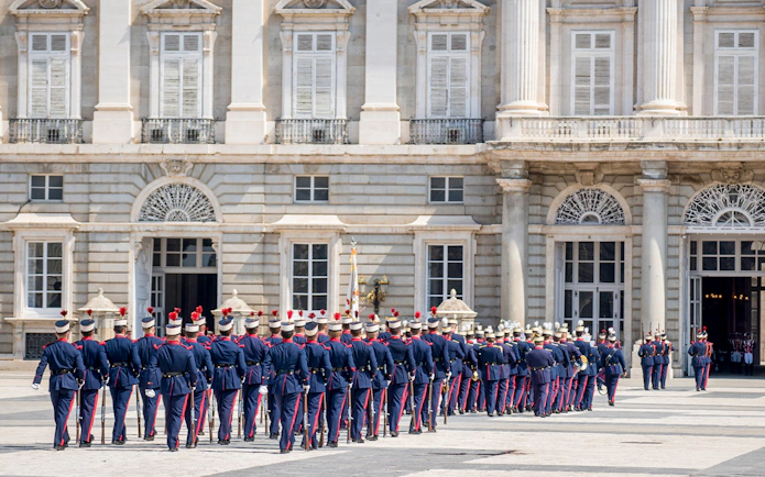 Guards marching at the Royal Palace in Madrid during the changing of the guard ceremony.