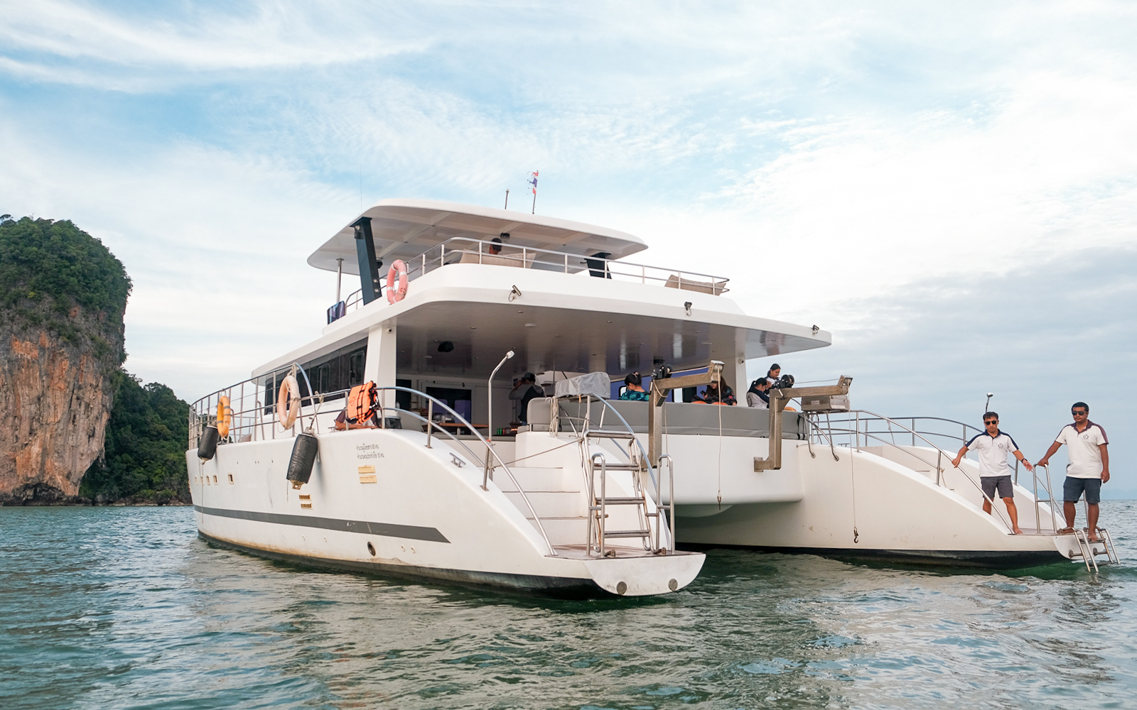 Premium yacht near limestone cliffs on James Bond Sunset Tour, Phuket.