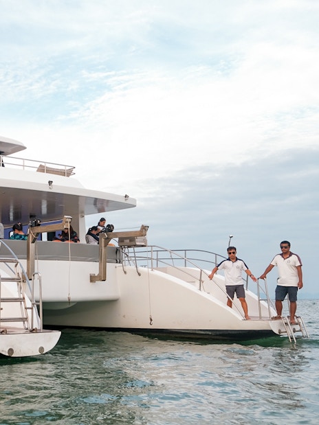 Premium yacht near limestone cliffs on James Bond Sunset Tour, Phuket.