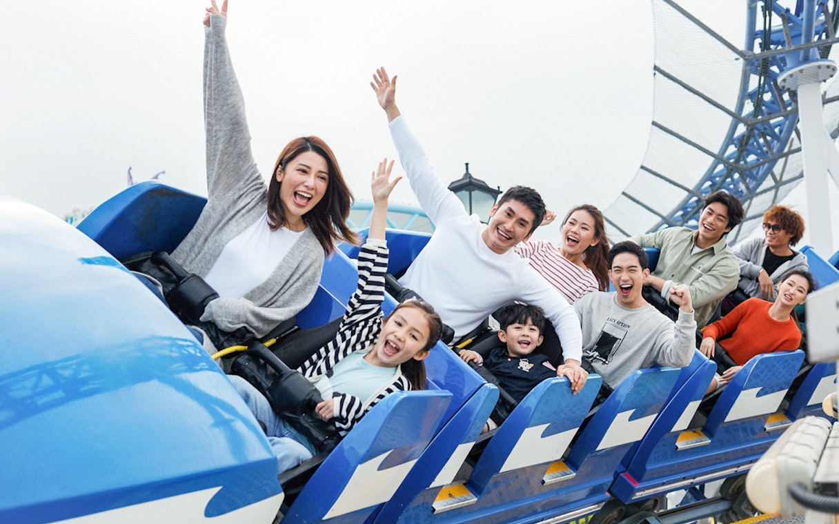 Visitors enjoying a roller coaster ride at Ocean Park with FasTrack tickets.