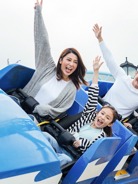 Visitors enjoying a roller coaster ride at Ocean Park with FasTrack tickets.