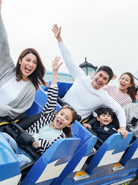 Visitors enjoying a roller coaster ride at Ocean Park with FasTrack tickets.