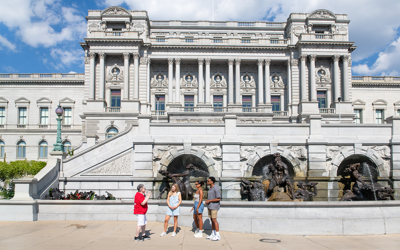 Tour group at the Library of Congress, Washington DC, with Neptune Fountain in foreground.