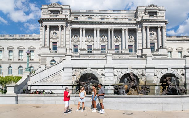Tour group at the Library of Congress, Washington DC, with Neptune Fountain in foreground.