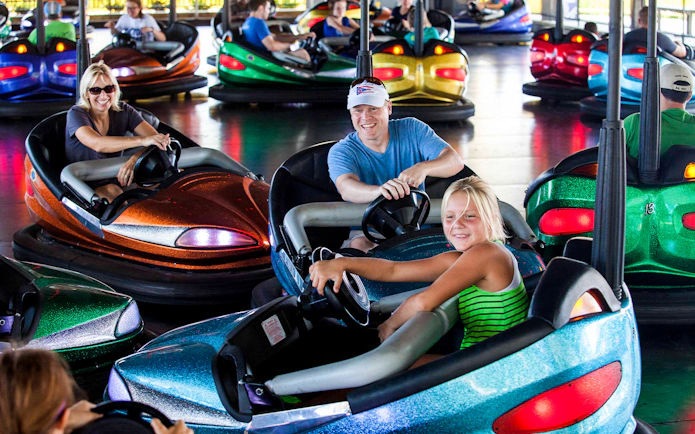 Visitors enjoying bumper cars at Bear Valley Bumper Buggies, Six Flags Darien Lake.