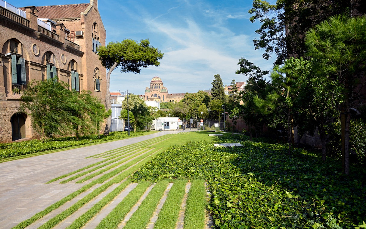 Recinto Modernista de Sant Pau gardens with historic architecture in Barcelona.