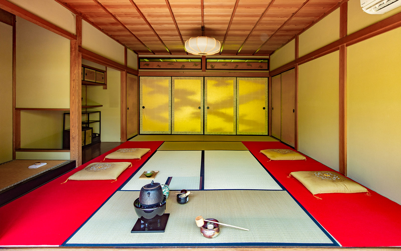 Traditional tatami room set for a private tea ceremony in Kyoto teahouse.