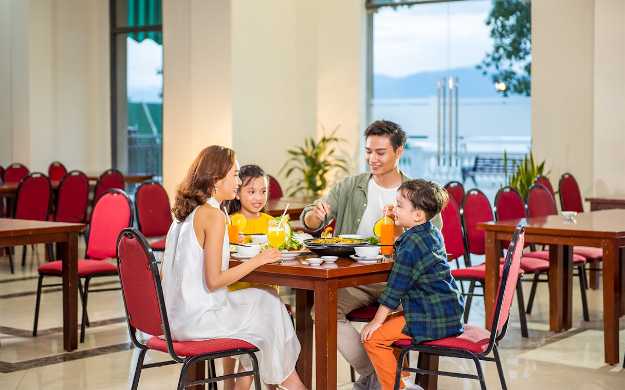 Family dining at a restaurant in VinWonders Nha Trang.
