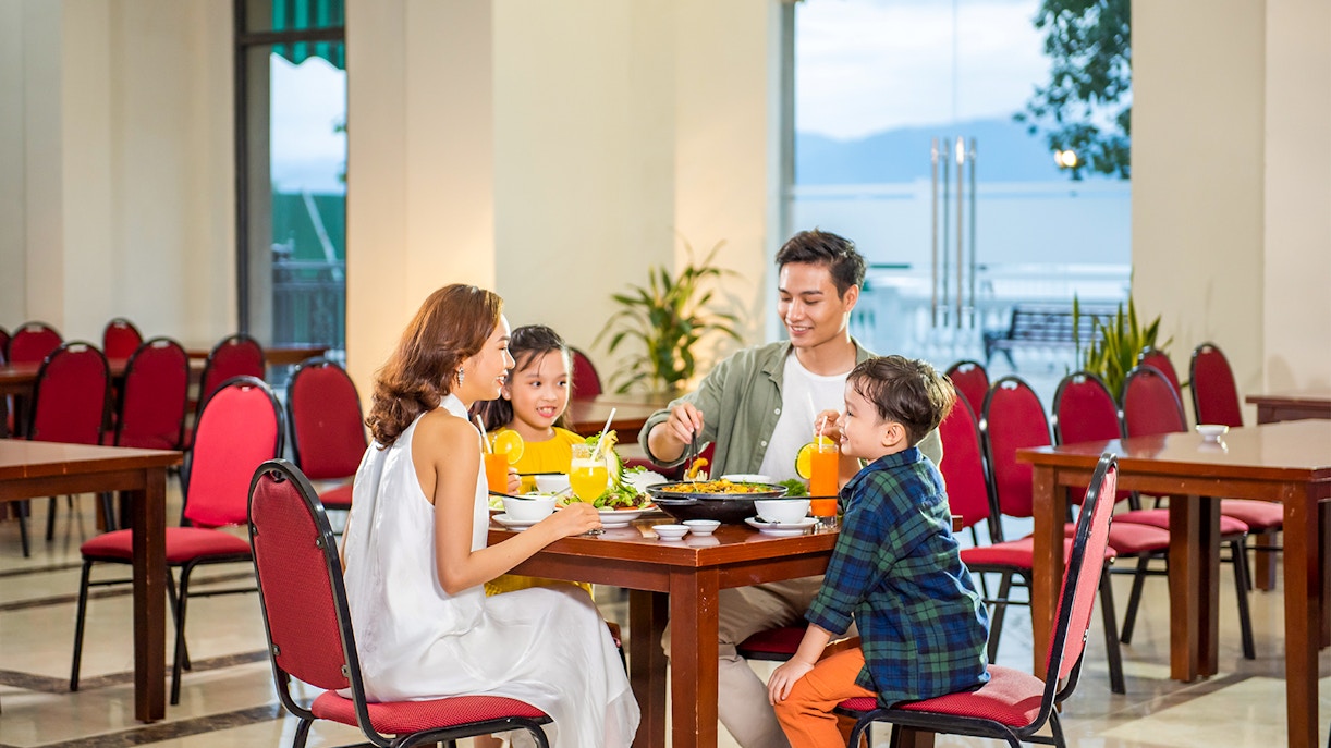 Family dining at a restaurant in VinWonders Nha Trang.