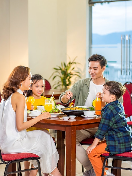 Family dining at a restaurant in VinWonders Nha Trang.