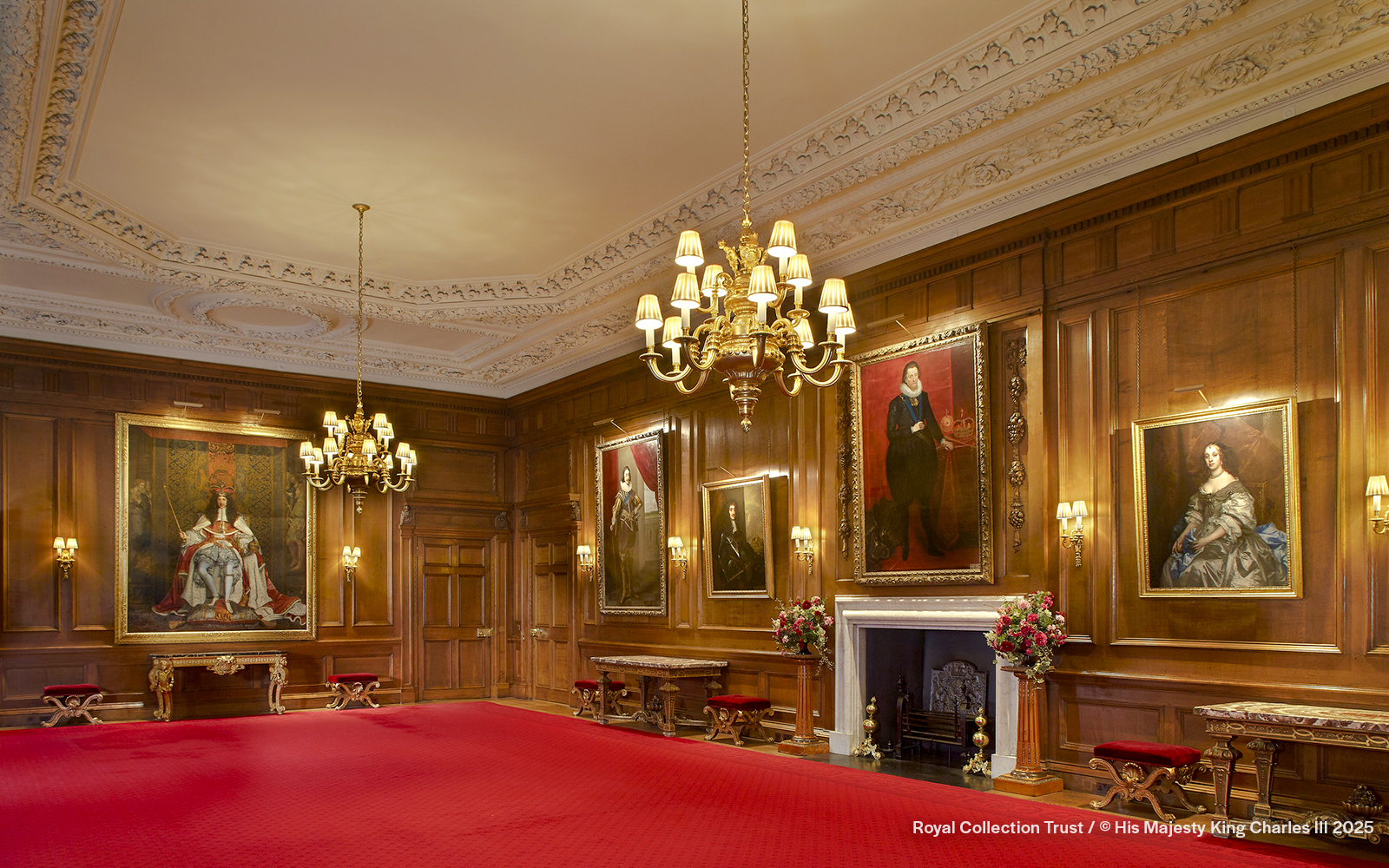 Throne Room at the Palace of Holyroodhouse with portraits and ornate chandelier.