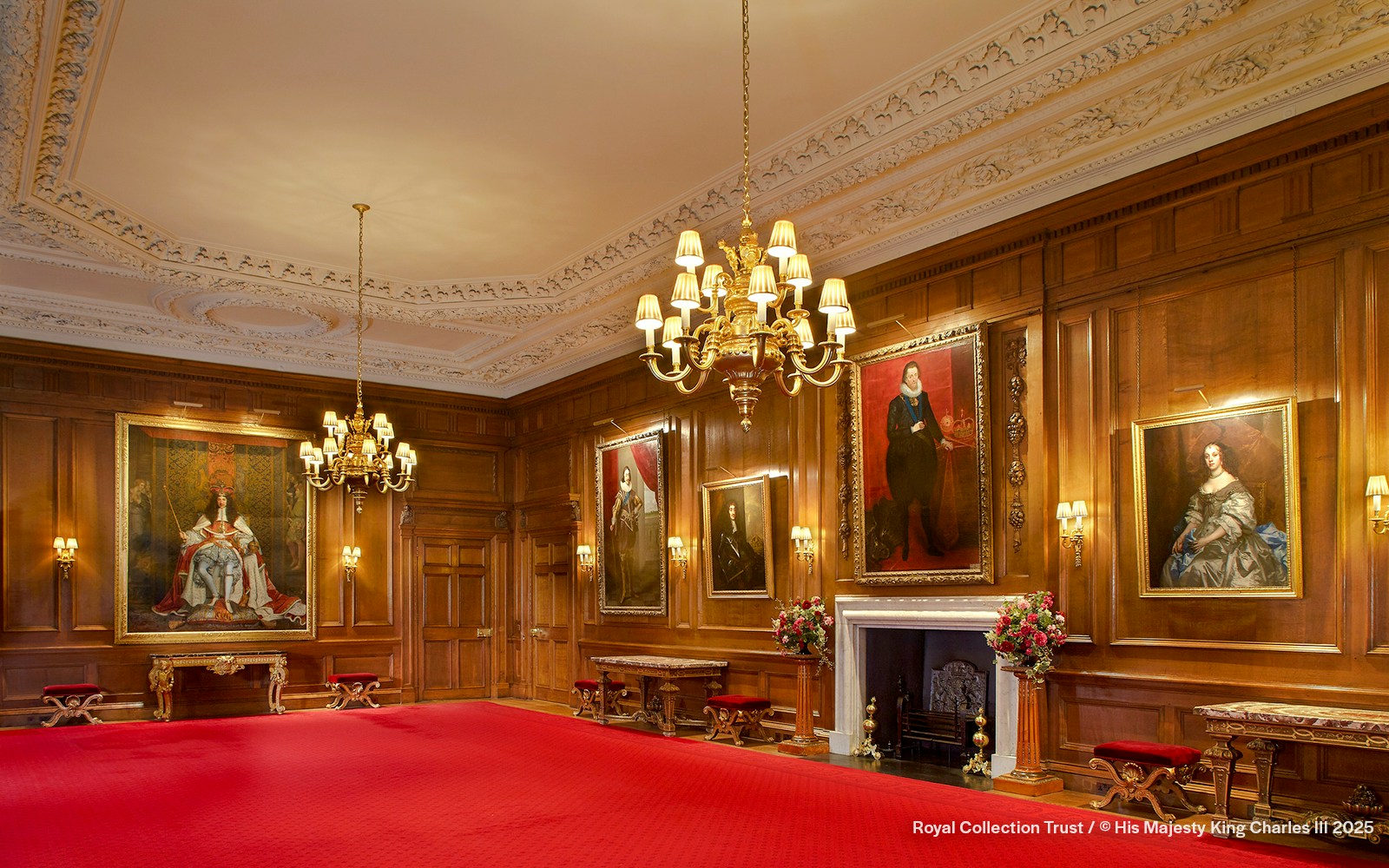 Throne Room at the Palace of Holyroodhouse with portraits and ornate chandelier.