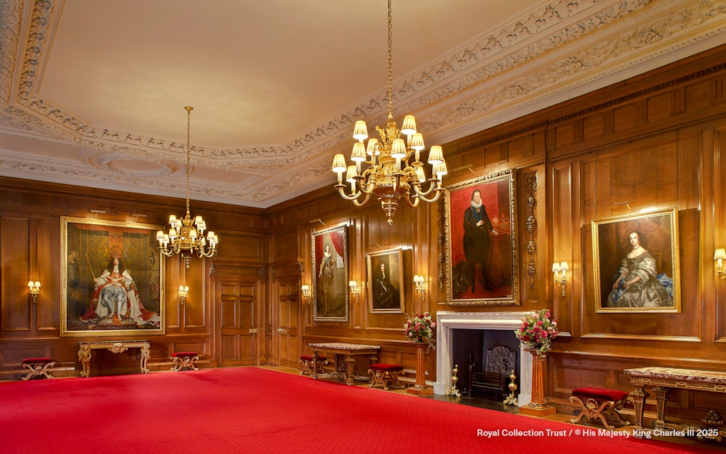 Throne Room at the Palace of Holyroodhouse with portraits and ornate chandelier.