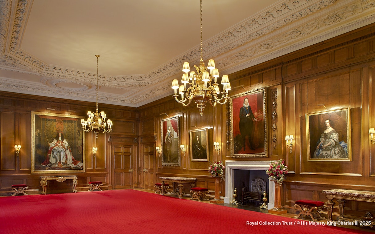 Throne Room at the Palace of Holyroodhouse with portraits and ornate chandelier.