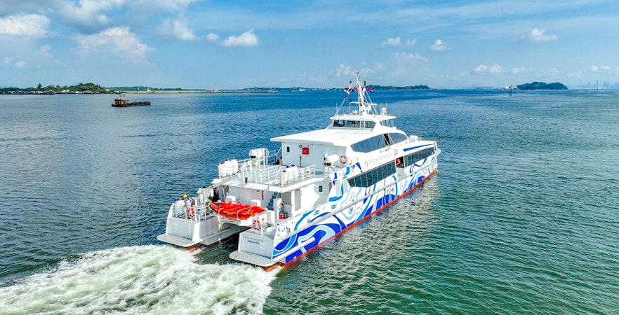 Ferry traveling from Singapore to Bintan across the open sea.