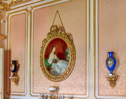 Golden-framed painting in Liria Palace, Madrid, showcasing historical art.